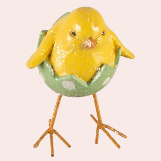 Stående kylling med hvitt og grønt egg