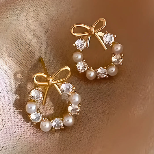 Øredobber krans med gullsløyfe