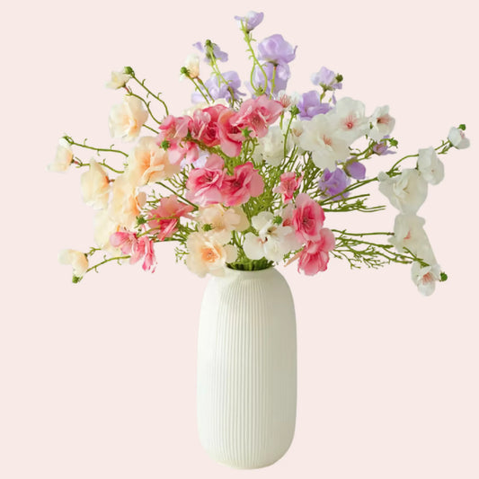 Bukett med fire ulike vårblomster