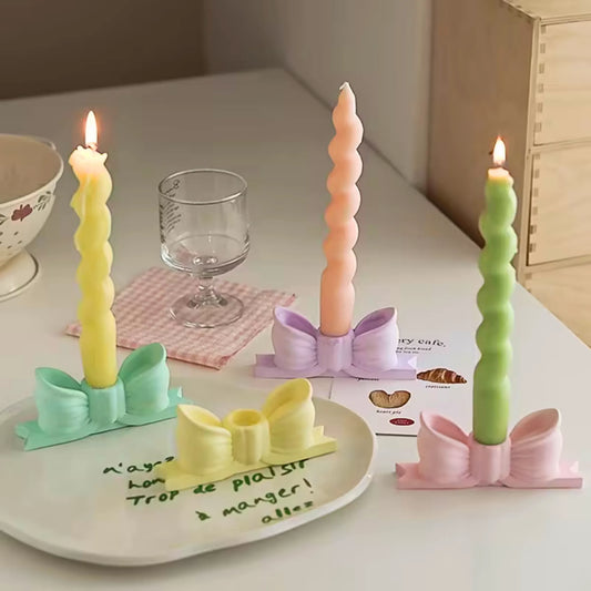 Rosa sløyfe lysestake for kronelys i nydelige pastellfarger