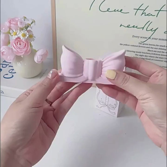 Lilla sløyfe lysestake for kronelys i nydelige pastellfarger